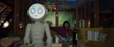 After losing her family to a plane accident, Suzie (played by Rashida Jones) receives a posthumous gift from her husband in the form of a robot named Sunny (voiced by Joanna Sotomura).  After losing her family to a plane accident, Suzie (played by Rashida Jones) receives a posthumous gift from her husband in the form of a robot named Sunny (voiced by Joanna Sotomura).