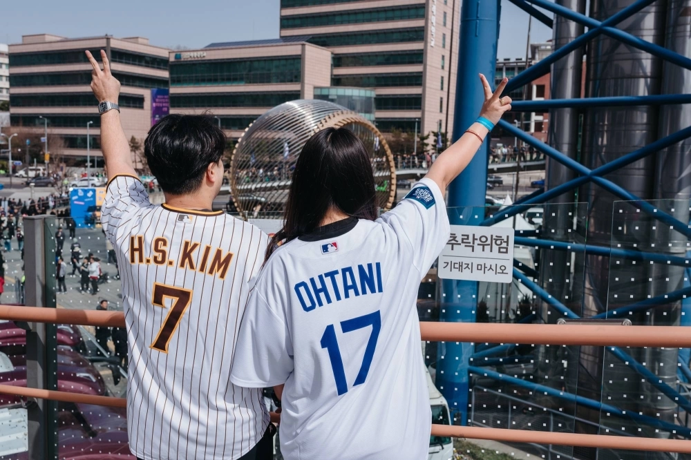 Baseballs fans wear jerseys of the South Korean-born San Diego Padres player Kim Ha-Seong and the Los Angeles Dodgers player Shohei Ohtani in Seoul. Many South Koreans have embraced Ohtani, who is Japanese, despite the countries' historic rivalry. Baseballs fans wear jerseys of the South Korean-born San Diego Padres player Kim Ha-Seong and the Los Angeles Dodgers player Shohei Ohtani in Seoul. Many South Koreans have embraced Ohtani, who is Japanese, despite the countries' historic rivalry.