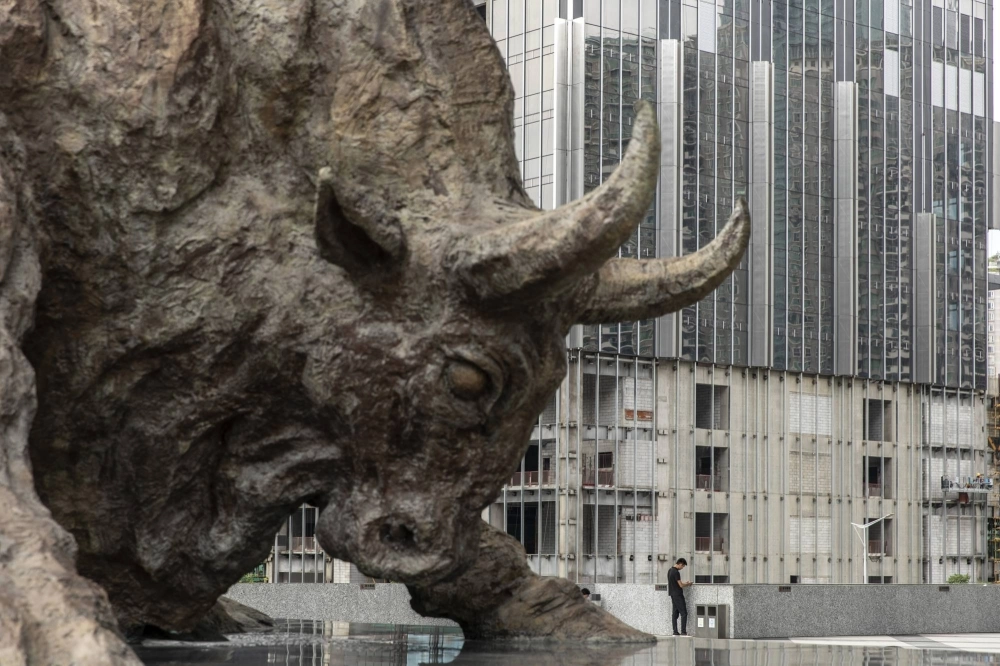 A bull statue stands outside the Shenzhen Stock Exchange building in Shenzhen in September 2019. A bull statue stands outside the Shenzhen Stock Exchange building in Shenzhen in September 2019.