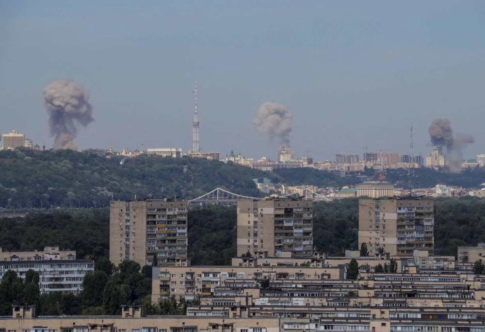 Smoke rises over the city after a Russian missile strike in Kyiv on Monday. Smoke rises over the city after a Russian missile strike in Kyiv on Monday.