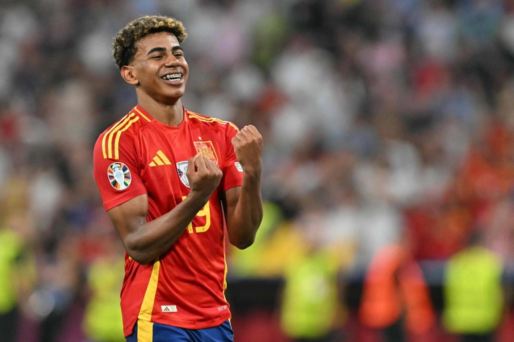 Spain forward Lamine Yamal celebrates his team's win over France in the Euro 2024 semifinals on Tuesday in Munich.  Spain forward Lamine Yamal celebrates his team's win over France in the Euro 2024 semifinals on Tuesday in Munich.
