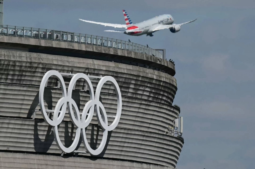 Olympic rings are displayed on Charles de Gaulle Airport near Paris ahead of the city hosting the 2024 Olympic Games. One way of reducing the carbon emissions of mega sporting events is to limit the attendance of spectators traveling by air. Olympic rings are displayed on Charles de Gaulle Airport near Paris ahead of the city hosting the 2024 Olympic Games. One way of reducing the carbon emissions of mega sporting events is to limit the attendance of spectators traveling by air.