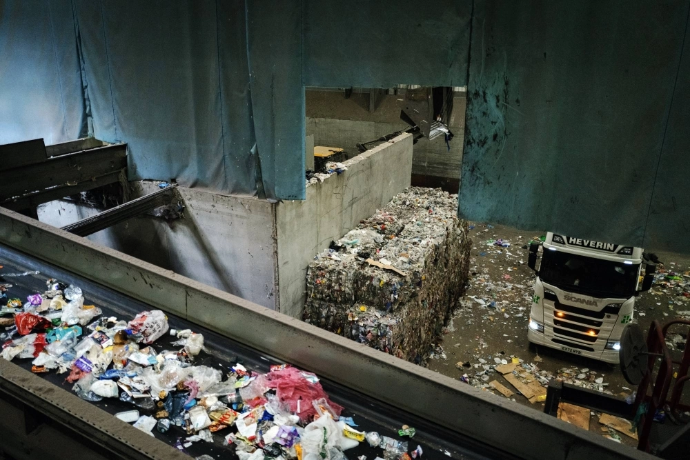 Plastic material is gathered at the end of the sorting process, baled and sent for further sorting or reprocessing. Plastic material is gathered at the end of the sorting process, baled and sent for further sorting or reprocessing.