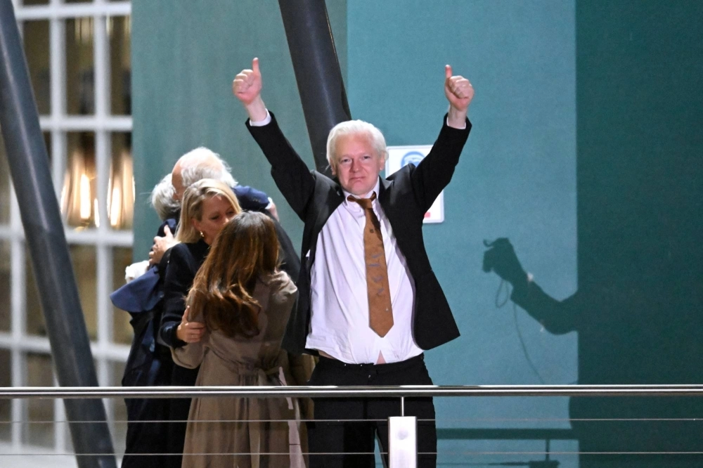 WikiLeaks founder Julian Assange is greeted by supporters after arriving at the airport in Canberra on June 26 as a free man.   WikiLeaks founder Julian Assange is greeted by supporters after arriving at the airport in Canberra on June 26 as a free man.