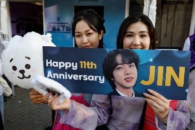 Fans celebrate BTS' 11th debut anniversary during 2024 FESTA, an event for fans of the K-pop boy band a day after band member Jin was discharged from the South Korean army after 18 months of military service, in Seoul on June 13. Fans celebrate BTS' 11th debut anniversary during 2024 FESTA, an event for fans of the K-pop boy band a day after band member Jin was discharged from the South Korean army after 18 months of military service, in Seoul on June 13.