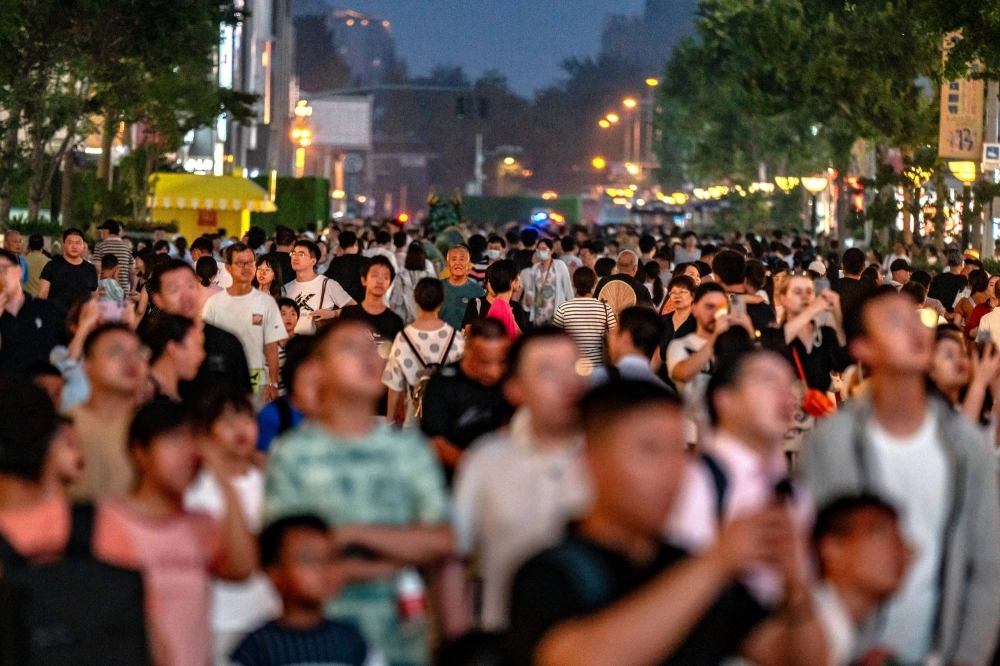 Pedestrians in the Wangfujing shopping area in Beijing on July 11, 2024. China's economic growth in the second quarter was lower than forecast, adding pressure on Chinese leaders to lift confidence at the Chinese Communist Party's third plenum this week. Pedestrians in the Wangfujing shopping area in Beijing on July 11, 2024. China's economic growth in the second quarter was lower than forecast, adding pressure on Chinese leaders to lift confidence at the Chinese Communist Party's third plenum this week.