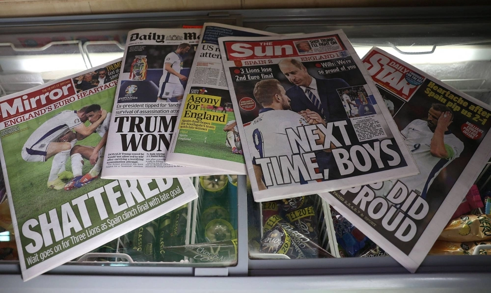 British newspapers with front-page stories covering England's loss to Spain in the UEFA Euro 2024 final on Sunday are displayed in a shop in Lewes, England, the following day. British newspapers with front-page stories covering England's loss to Spain in the UEFA Euro 2024 final on Sunday are displayed in a shop in Lewes, England, the following day.
