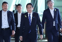 Prime Minister Fumio Kishida enters his office in Tokyo on July 4.  | JIJI