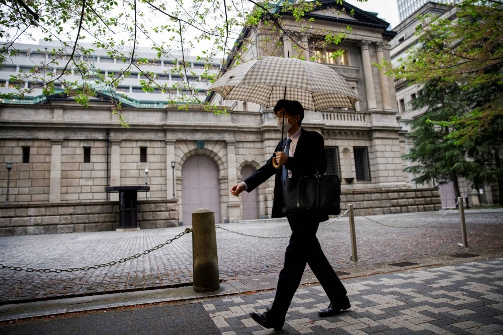 The Bank of Japan headquarters in Tokyo. A Bloomberg survey showed some 14 of 48 economists predict the BOJ will raise its policy rate at the next week’s meeting. The Bank of Japan headquarters in Tokyo. A Bloomberg survey showed some 14 of 48 economists predict the BOJ will raise its policy rate at the next week’s meeting.