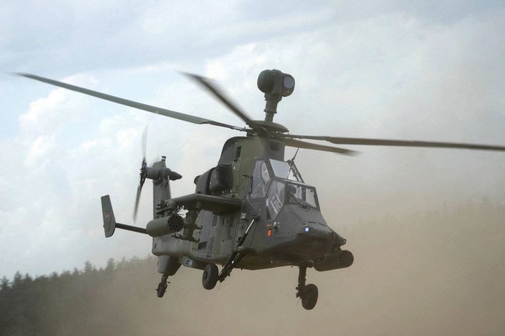 A German army Eurocopter Tiger helicopter flies during the Quadriga 2024 military exercises in Pabrade, Lithuania, on May 29. A German army Eurocopter Tiger helicopter flies during the Quadriga 2024 military exercises in Pabrade, Lithuania, on May 29.