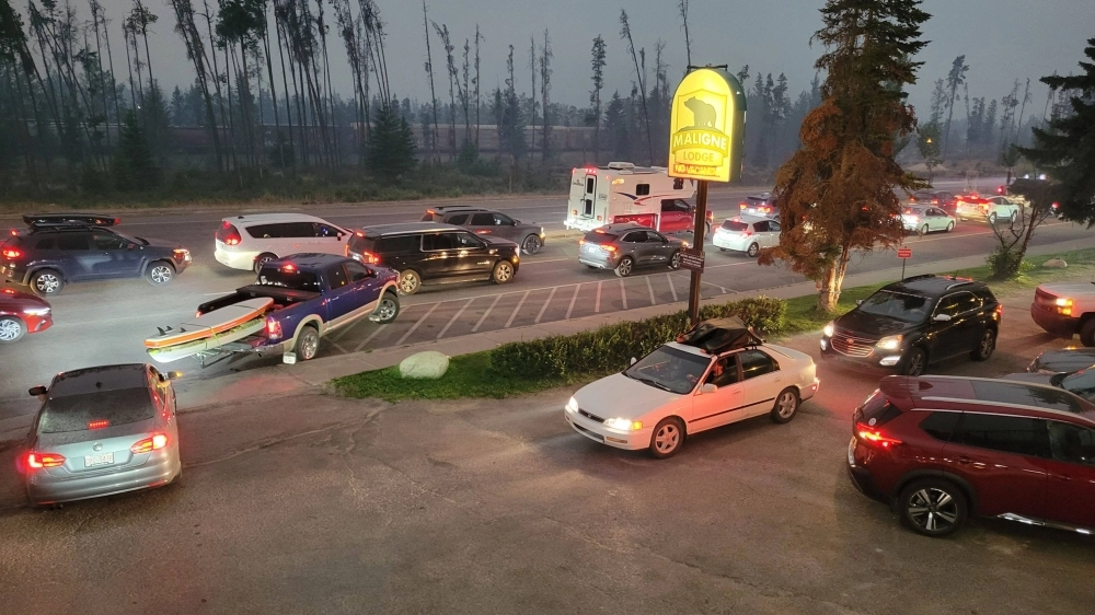 Visitors evacuate from Jasper National Park in Canada on Monday due to a wildfire. Visitors evacuate from Jasper National Park in Canada on Monday due to a wildfire.