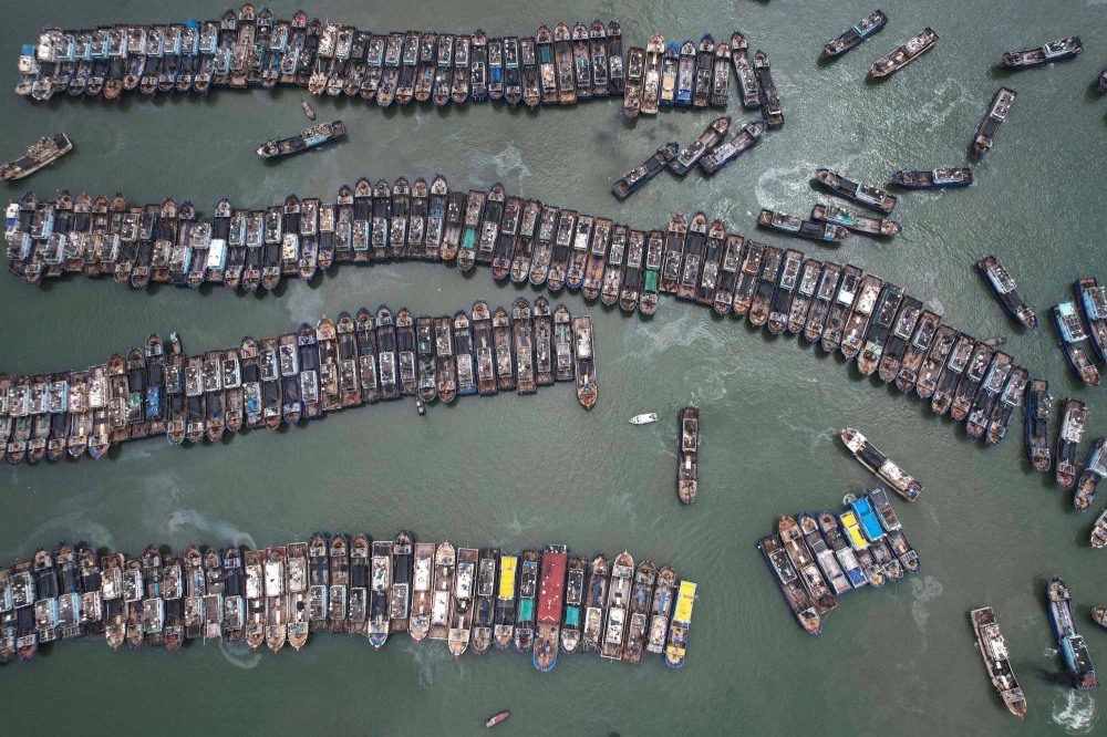 Fishing boats berth at a port to avoid Typhoon Gaemi in Xiamen, Fujian province, on Wednesday. Fishing boats berth at a port to avoid Typhoon Gaemi in Xiamen, Fujian province, on Wednesday.