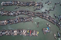 Fishing boats berth at a port to avoid Typhoon Gaemi in Xiamen, Fujian province, on Wednesday. | AFP-Jiji