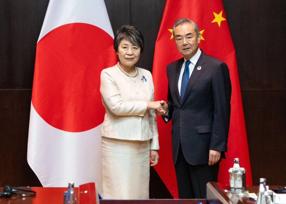 Foreign Minister Yoko Kamikawa and Chinese Foreign Minister Wang Yi meet on the sidelines of Association of Southeast Asian Nations meetings in Vientiane, Laos, on Friday. Foreign Minister Yoko Kamikawa and Chinese Foreign Minister Wang Yi meet on the sidelines of Association of Southeast Asian Nations meetings in Vientiane, Laos, on Friday.