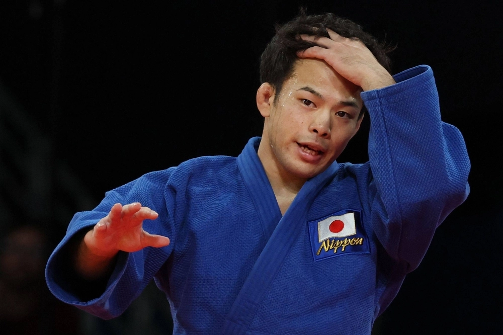Ryuju Nagayama reacts after his quarterfinal bout against Spain's Francisco Garrigos at the Paris Olympics on Saturday. Ryuju Nagayama reacts after his quarterfinal bout against Spain's Francisco Garrigos at the Paris Olympics on Saturday.