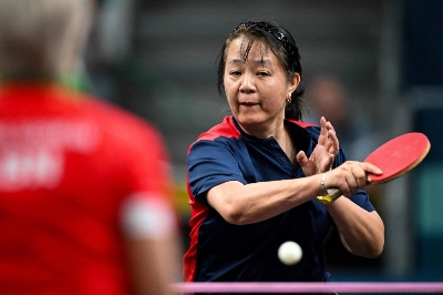 Chile's Zhiying Zeng plays a return during her preliminary round match at the Paris Olympics on Saturday.  Chile's Zhiying Zeng plays a return during her preliminary round match at the Paris Olympics on Saturday.