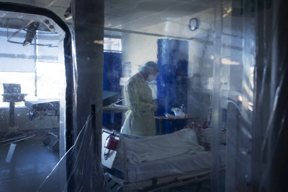 A doctor consults with a COVID-19 patient at St. Vincent's Hospital in Sydney in 2021. A doctor consults with a COVID-19 patient at St. Vincent's Hospital in Sydney in 2021.