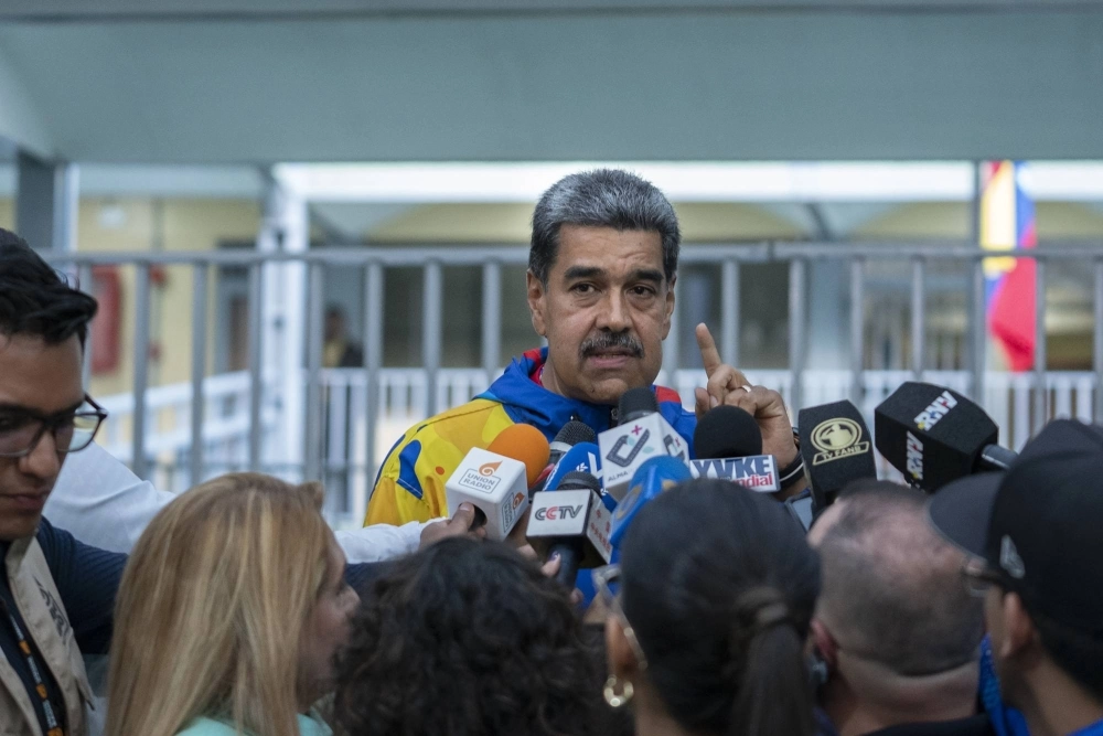 Nicolas Maduro speaks to members of the media after casting a ballot in Caracas on Sunday. Nicolas Maduro speaks to members of the media after casting a ballot in Caracas on Sunday.