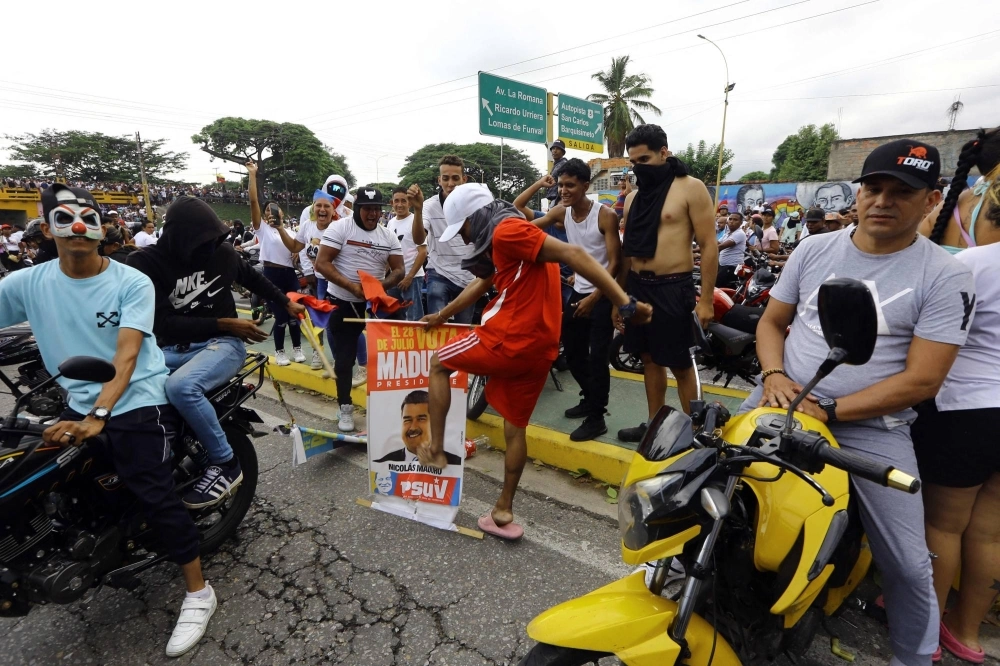 Demonstrators march in Valencia, Venezuela, on Monday, a day after the Venezuelan presidential election. Protests erupted in parts of Caracas and elsewhere against the re-election victory claimed by President Nicolas Maduro. Demonstrators march in Valencia, Venezuela, on Monday, a day after the Venezuelan presidential election. Protests erupted in parts of Caracas and elsewhere against the re-election victory claimed by President Nicolas Maduro.