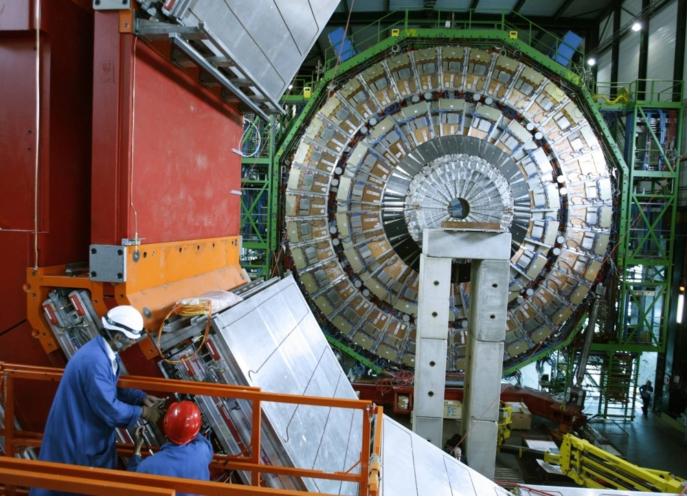 Technicians assemble a component of the Compact Muon Solenoid experiment at the CERN nuclear research facility in Cessy, France, in March 2007. International cooperation in science is essential for solving global challenges and maintaining innovation.  Technicians assemble a component of the Compact Muon Solenoid experiment at the CERN nuclear research facility in Cessy, France, in March 2007. International cooperation in science is essential for solving global challenges and maintaining innovation.