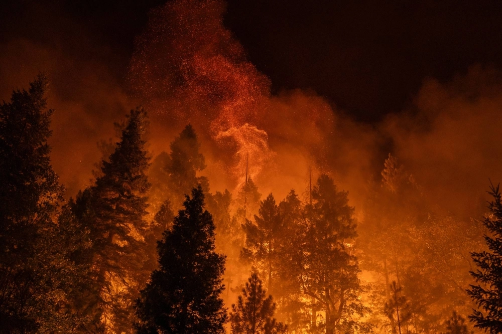 Embers rise into the air as firefighters set a controlled burn along Highway 32 near Chico, California, on Tuesday.  Embers rise into the air as firefighters set a controlled burn along Highway 32 near Chico, California, on Tuesday.