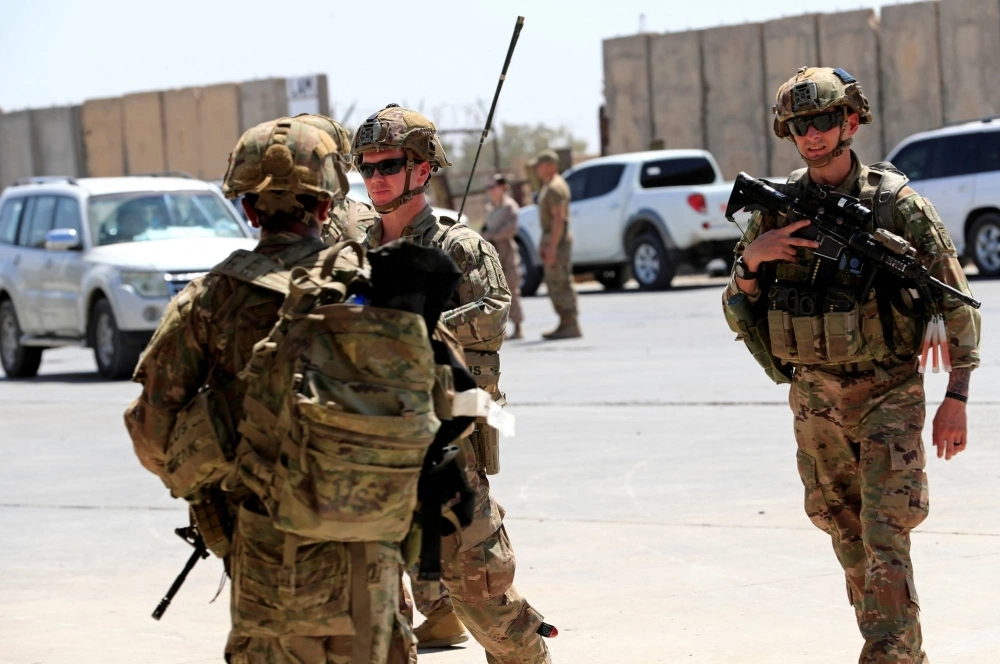 U.S. soldiers are seen during the handover ceremony for Taji military base, from U.S.-led coalition troops to Iraqi security forces, in the base north of Baghdad in 2020. U.S. soldiers are seen during the handover ceremony for Taji military base, from U.S.-led coalition troops to Iraqi security forces, in the base north of Baghdad in 2020.