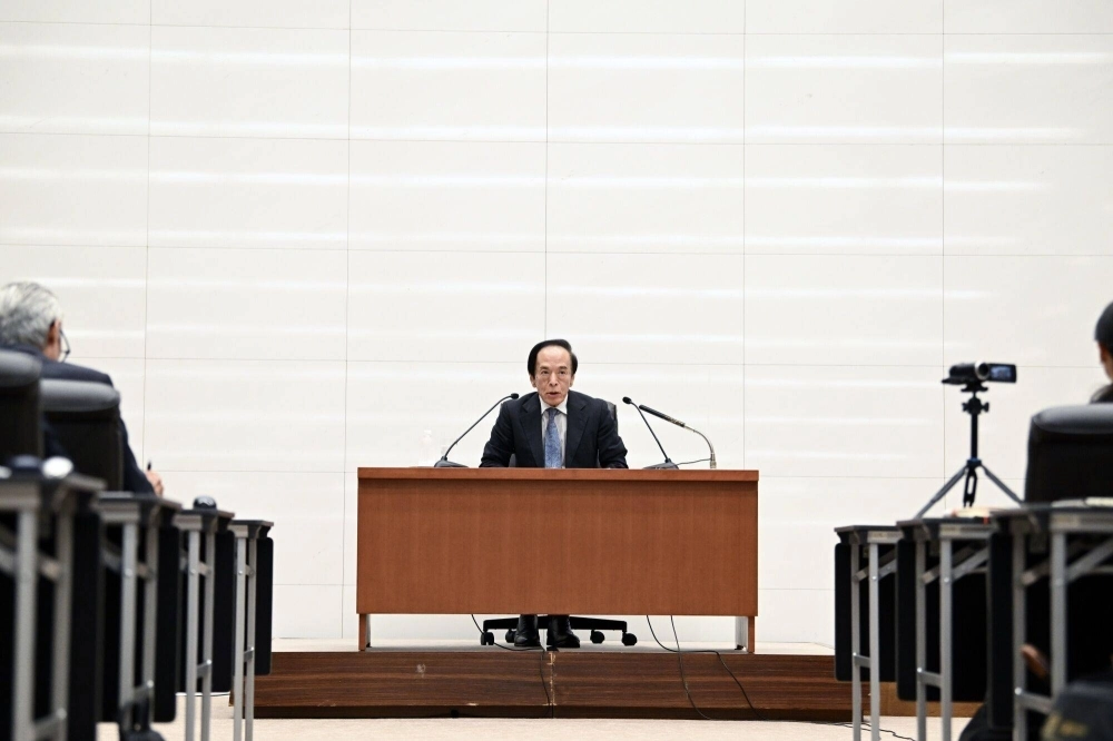 Bank of Japan Gov. Kazuo Ueda holds a news conference at the central bank's headquarters in Tokyo on Wednesday. The bank raised rates to 0.25% in just the second hike since 2007. Bank of Japan Gov. Kazuo Ueda holds a news conference at the central bank's headquarters in Tokyo on Wednesday. The bank raised rates to 0.25% in just the second hike since 2007.