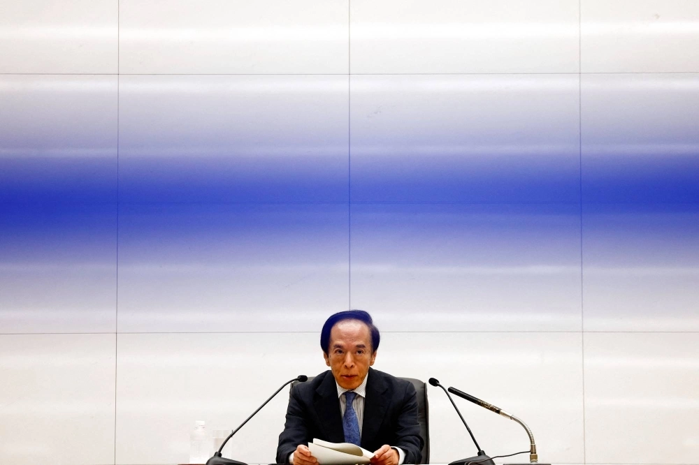 Bank of Japan Gov. Kazuo Ueda attends a news conference after the central bank's policy meeting, in Tokyo on Wednesday. Bank of Japan Gov. Kazuo Ueda attends a news conference after the central bank's policy meeting, in Tokyo on Wednesday.