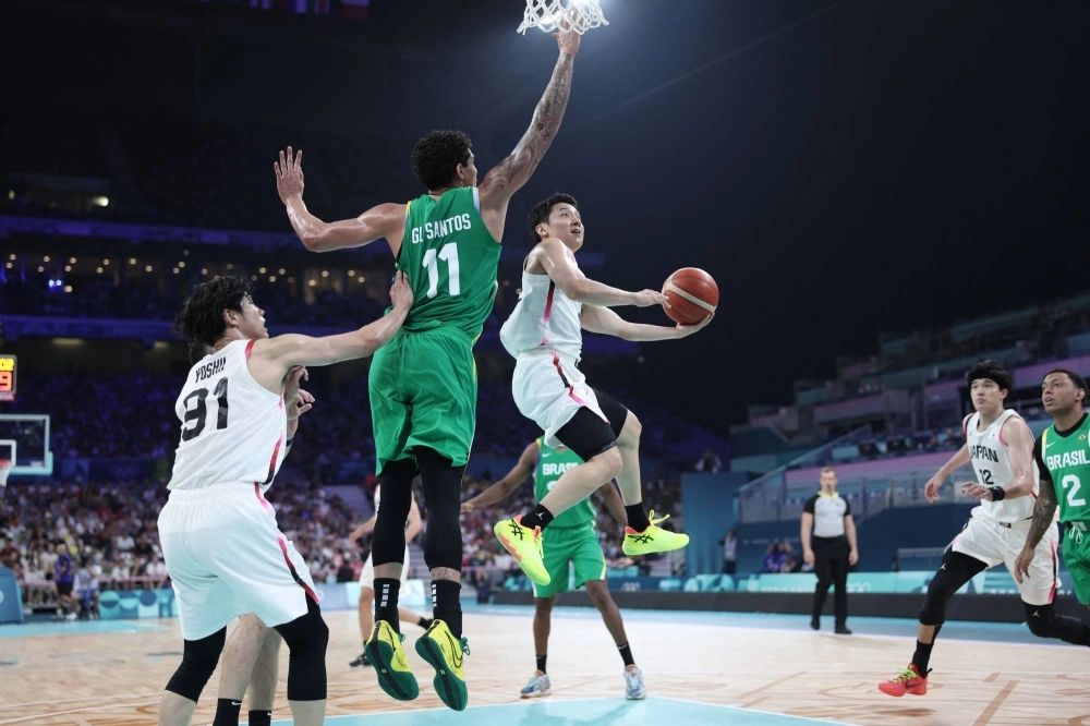 Japan's Yuki Kawamura goes to the basket in the men's preliminary round group B basketball match between Japan and Brazil during the Paris 2024 Olympic Games at the Pierre-Mauroy stadium in Villeneuve-d'Ascq, northern France, on Friday. Japan's Yuki Kawamura goes to the basket in the men's preliminary round group B basketball match between Japan and Brazil during the Paris 2024 Olympic Games at the Pierre-Mauroy stadium in Villeneuve-d'Ascq, northern France, on Friday.