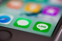 The Internal Affairs and Communications Ministry has said the 50-50 control of LY, the operator of the Line app, by SoftBank and Naver leaves the messaging app vulnerable to cyberattacks. | Bloomberg