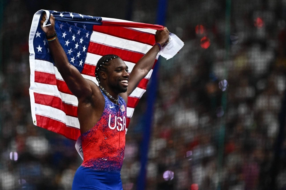 Noah Lyles celebrates after winning gold in the men's 100-meter final at the Paris Olympics on Sunday.  Noah Lyles celebrates after winning gold in the men's 100-meter final at the Paris Olympics on Sunday.