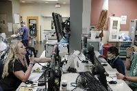 Workers at the University of New Mexico Hospital’s emergency department in Albuquerque on June 10 | Ramsay de Give / The New York Times