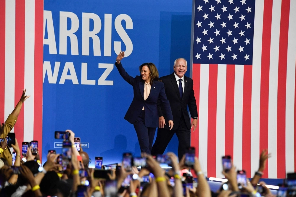 U.S. Vice President and 2024 Democratic presidential candidate, Kamala Harris, and her just-announced running mate, Minnesota Gov. Tim Walz, greet supporters on Tuesday at Temple University in Philadelphia, the first day of their "Battleground State Tour." U.S. Vice President and 2024 Democratic presidential candidate, Kamala Harris, and her just-announced running mate, Minnesota Gov. Tim Walz, greet supporters on Tuesday at Temple University in Philadelphia, the first day of their "Battleground State Tour."