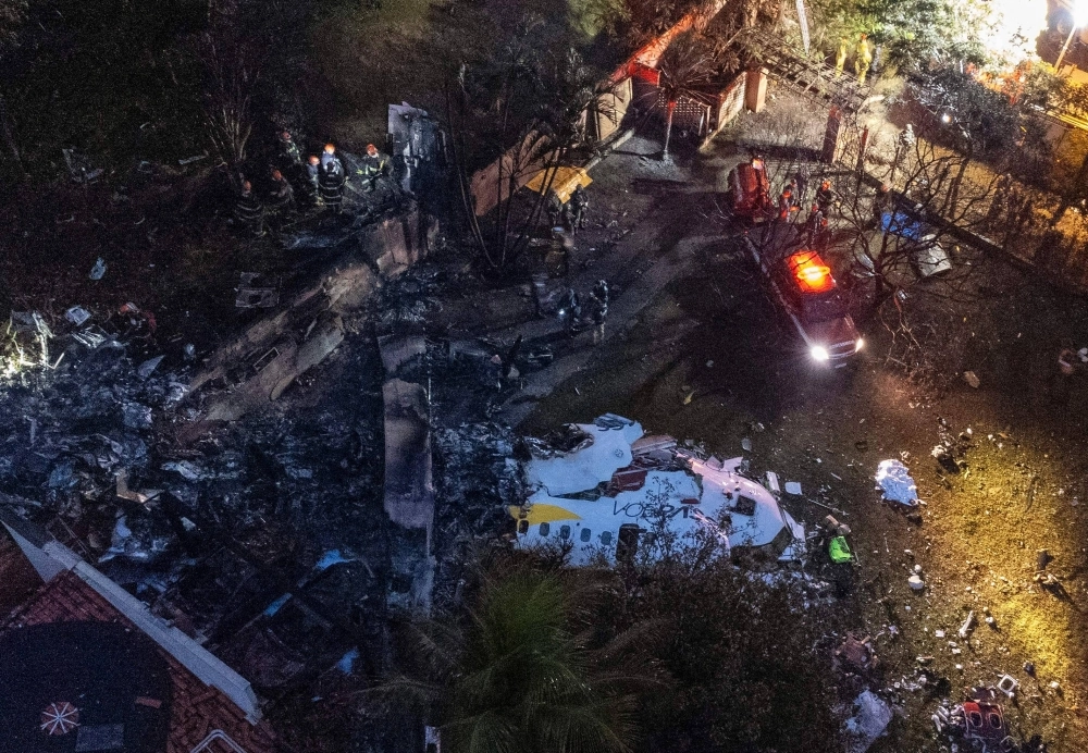 Aerial view of the wreckage of an airplane that crashed with 61 people on board in Vinhedo, Sao Paulo State, Brazil, on Friday. Aerial view of the wreckage of an airplane that crashed with 61 people on board in Vinhedo, Sao Paulo State, Brazil, on Friday.