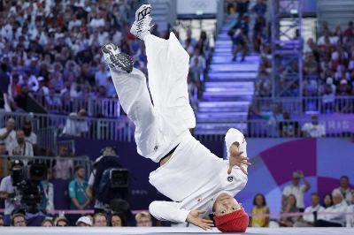 Canada's Phil Wizard, whose real name is Philip Kim, competes in the men's breaking competition at the Paris Olympics on Saturday.  Canada's Phil Wizard, whose real name is Philip Kim, competes in the men's breaking competition at the Paris Olympics on Saturday.