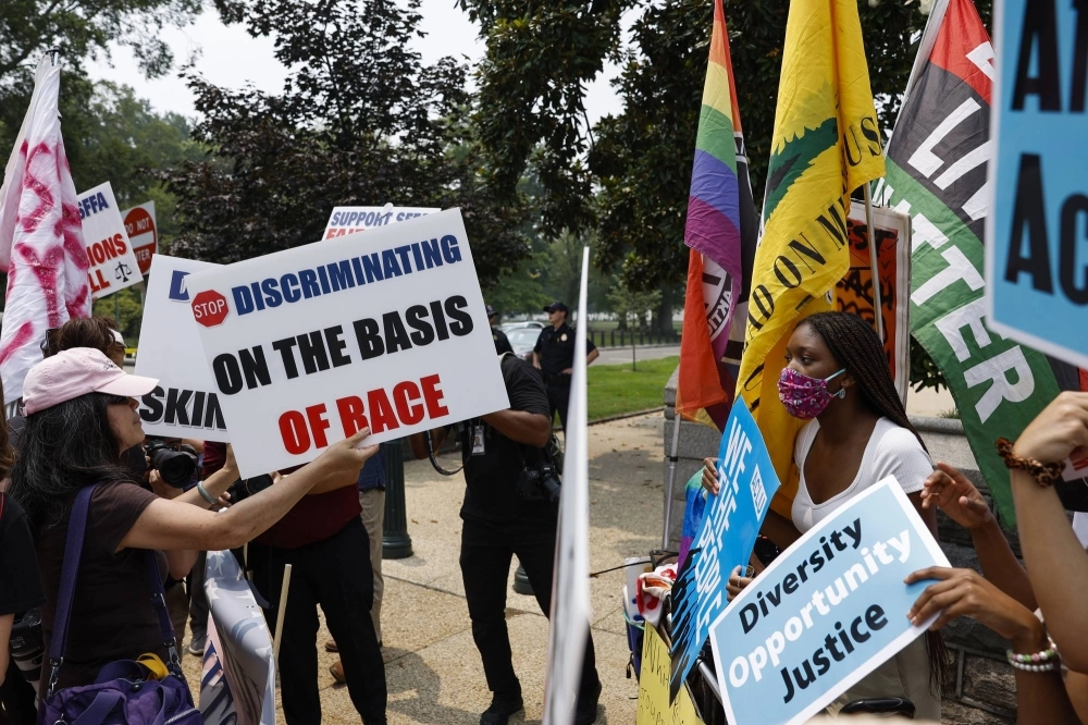 Protesters for and against affirmative action demonstrate on Capitol Hill in Washington. As the backlash against diversity, equity and inclusion (DEI) has intensified in the U.S., the number of so-called anti-DEI proposals have multiplied. Protesters for and against affirmative action demonstrate on Capitol Hill in Washington. As the backlash against diversity, equity and inclusion (DEI) has intensified in the U.S., the number of so-called anti-DEI proposals have multiplied.