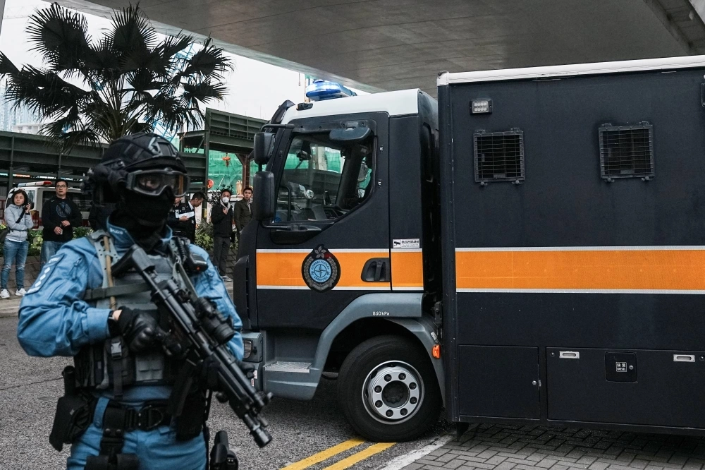 A prison van that is believed to carry media mogul Jimmy Lai, the founder of Apple Daily newspaper, leaves the West Kowloon Magistrates' Courts on the day of the national security trial, in Hong Kong on Dec. 18, 2023.  A prison van that is believed to carry media mogul Jimmy Lai, the founder of Apple Daily newspaper, leaves the West Kowloon Magistrates' Courts on the day of the national security trial, in Hong Kong on Dec. 18, 2023.
