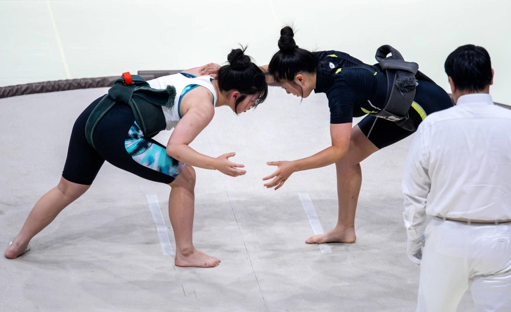 Yuzuki Komiya (left) competes in the first national high school sumo tournament for girls in Tachikawa, western Tokyo, on Saturday. Yuzuki Komiya (left) competes in the first national high school sumo tournament for girls in Tachikawa, western Tokyo, on Saturday.
