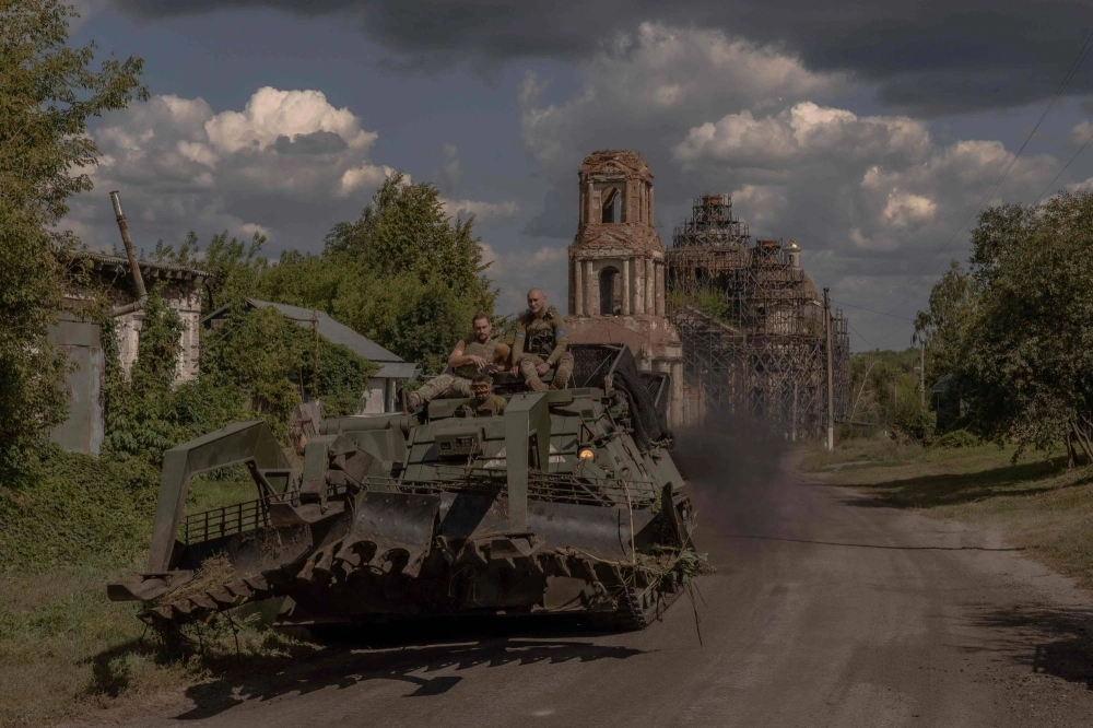 Ukrainian servicemen operate an armoured military vehicle on a road near the border with Russia, in the Sumy region of Ukraine, on Tuesday. The Ukrainian army entered Russia's Kursk region on Aug. 6, capturing dozens of settlements in the biggest offensive by a foreign army on Russian soil since World War II. Ukrainian servicemen operate an armoured military vehicle on a road near the border with Russia, in the Sumy region of Ukraine, on Tuesday. The Ukrainian army entered Russia's Kursk region on Aug. 6, capturing dozens of settlements in the biggest offensive by a foreign army on Russian soil since World War II.