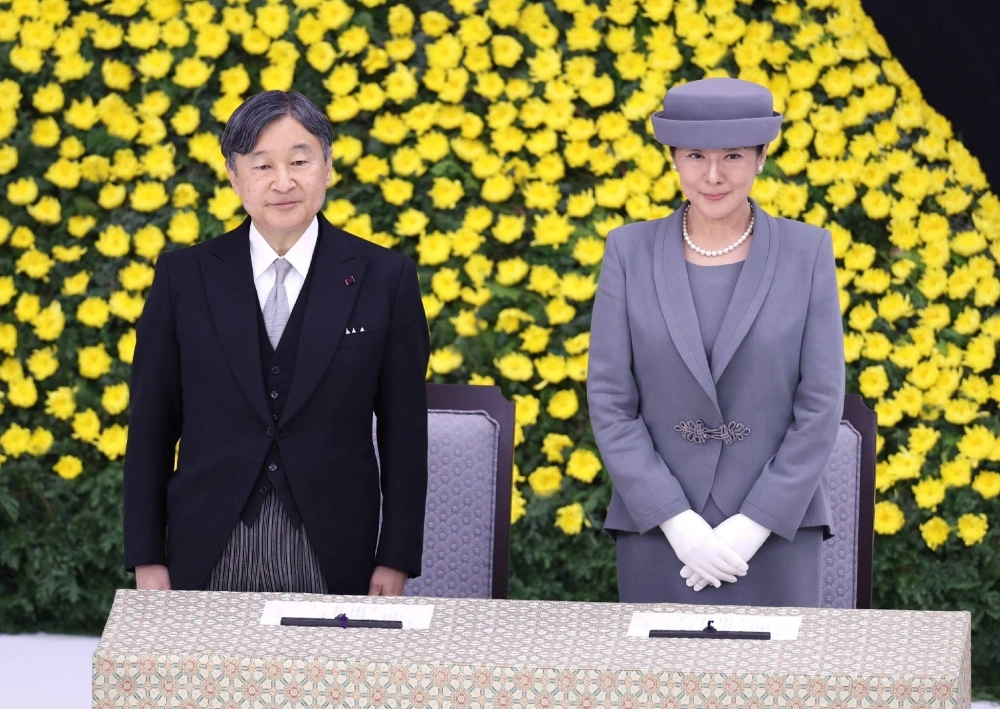 Emperor Naruhito and Empress Masako attend a government-hosted national memorial service for World War II casualties at the the Nippon Budokan hall in Tokyo on Thursday.  Emperor Naruhito and Empress Masako attend a government-hosted national memorial service for World War II casualties at the the Nippon Budokan hall in Tokyo on Thursday.