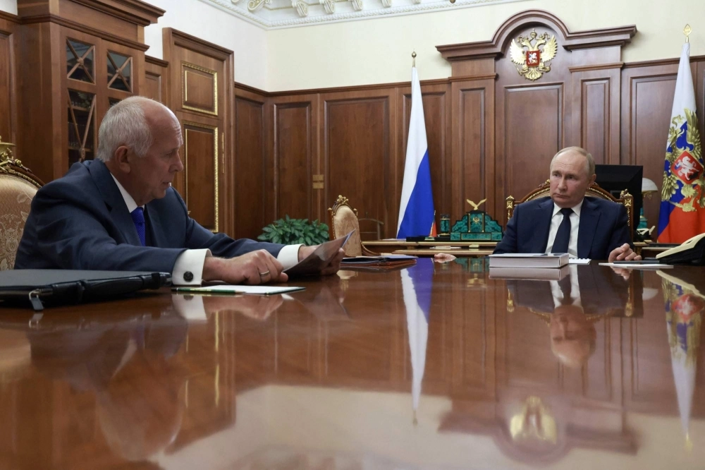 Russian President Vladimir Putin attends a meeting with Rostec CEO Sergei Chemezov in Moscow on July 30. Russian President Vladimir Putin attends a meeting with Rostec CEO Sergei Chemezov in Moscow on July 30.