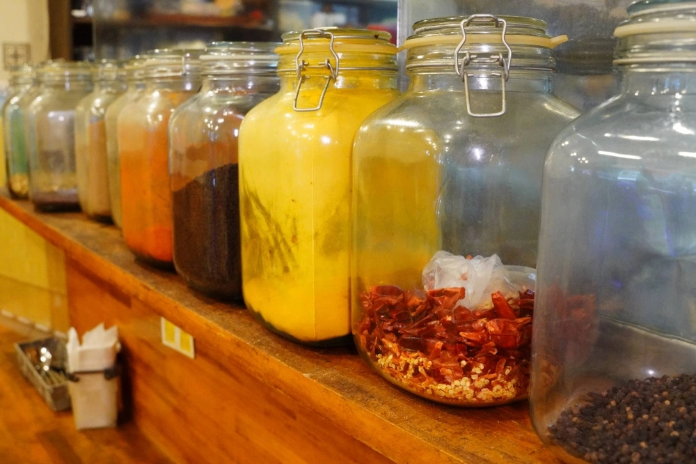 The spices on display atop the counter at Rodin symbolize its owner's lifelong love of and experimentation with the flavors that make curry what it is. The spices on display atop the counter at Rodin symbolize its owner's lifelong love of and experimentation with the flavors that make curry what it is.