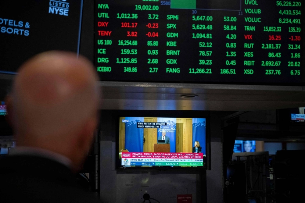 A television station broadcasts U.S. Federal Reserve Chair Chair Jerome Powell speaking in Jackson Hole, Wyoming, on the floor of the New York Stock Exchange in New York on Friday. A television station broadcasts U.S. Federal Reserve Chair Chair Jerome Powell speaking in Jackson Hole, Wyoming, on the floor of the New York Stock Exchange in New York on Friday.