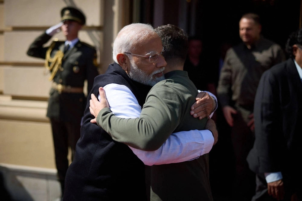 Ukrainian President Volodymyr Zelenskyy and Indian Prime Minister Narendra Modi embrace at the entrance of the Mariinskyi Palace ahead of their meeting in Kyiv on Friday.   Ukrainian President Volodymyr Zelenskyy and Indian Prime Minister Narendra Modi embrace at the entrance of the Mariinskyi Palace ahead of their meeting in Kyiv on Friday.