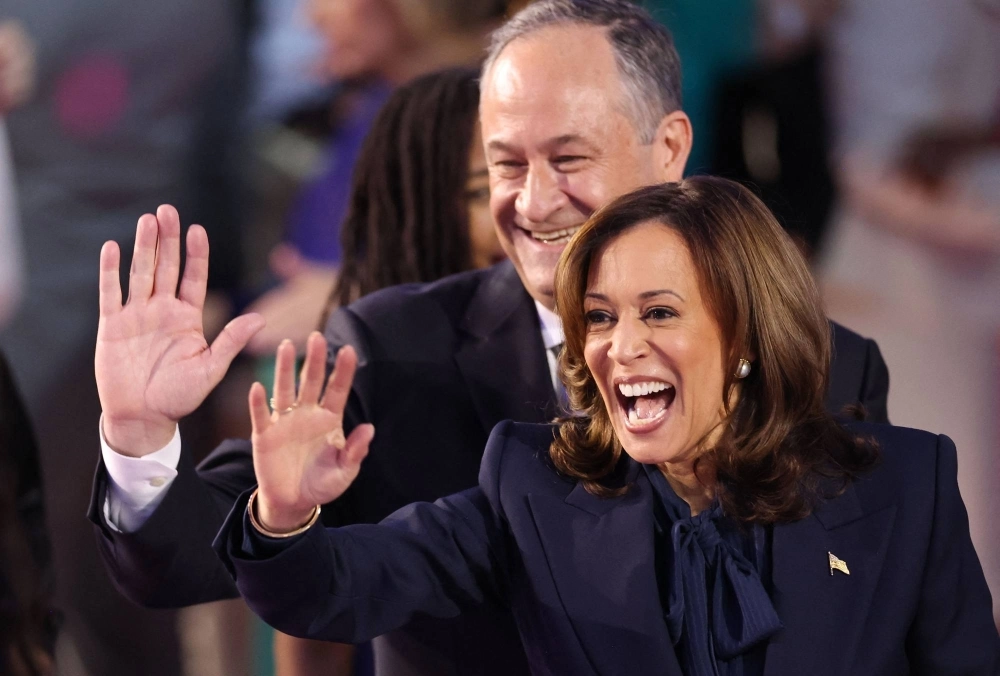 U.S. Vice President and 2024 Democratic presidential nominee Kamala Harris and her husband, second gentleman Douglas Emhoff, wave from the stage on the fourth and last day of the Democratic National Convention at the United Center in Chicago on Thursday. U.S. Vice President and 2024 Democratic presidential nominee Kamala Harris and her husband, second gentleman Douglas Emhoff, wave from the stage on the fourth and last day of the Democratic National Convention at the United Center in Chicago on Thursday.