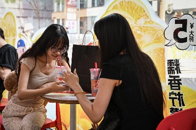 People at bubble tea chain Mixue Bingcheng in Beijing on Thursday. Bubble tea is wildly popular in China, where people sipping through straws from large plastic cups is a common sight across the country.  People at bubble tea chain Mixue Bingcheng in Beijing on Thursday. Bubble tea is wildly popular in China, where people sipping through straws from large plastic cups is a common sight across the country.