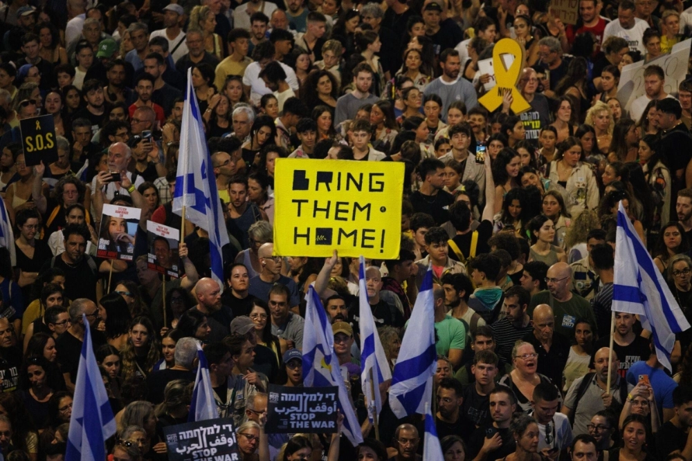 Israelis demand hostages be released and protest against the government during a demonstration in Tel Aviv on Sunday. Israelis demand hostages be released and protest against the government during a demonstration in Tel Aviv on Sunday.