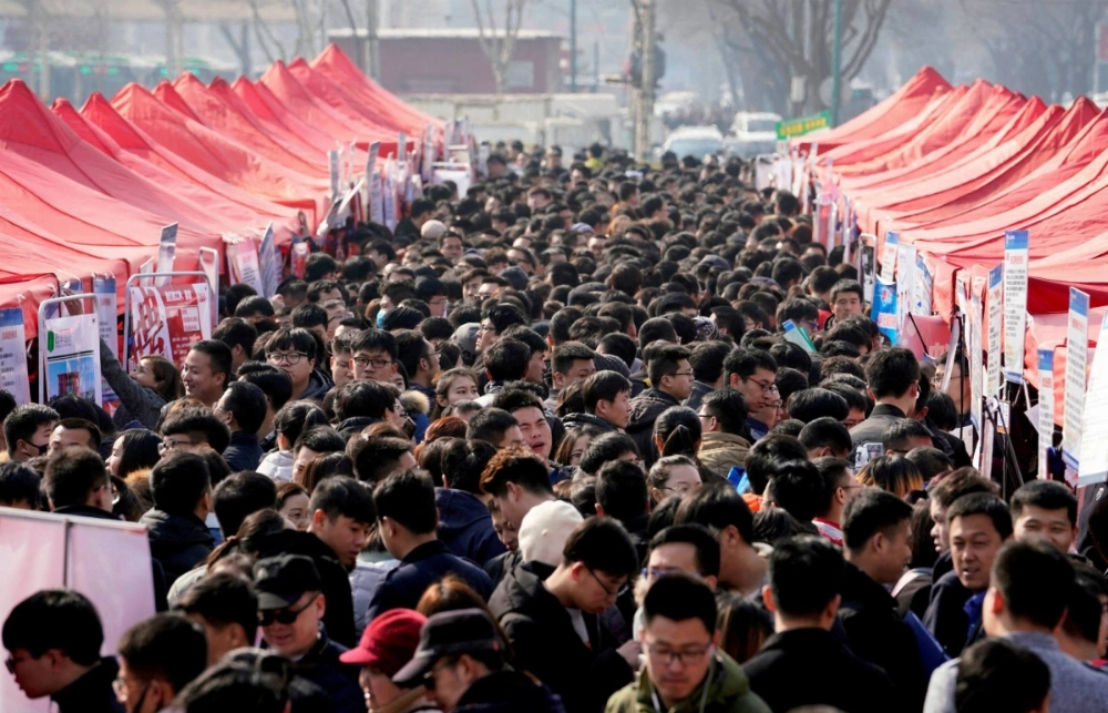 Job seekers crowd a job fair at Liberation Square in Shijiazhuang, China, in 2018. Job seekers crowd a job fair at Liberation Square in Shijiazhuang, China, in 2018.