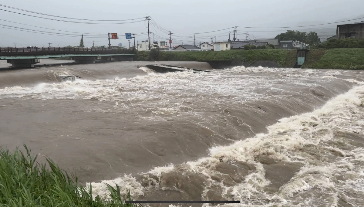 Water levels rising high in a river in southern Kagoshima on Friday Water levels rising high in a river in southern Kagoshima on Friday