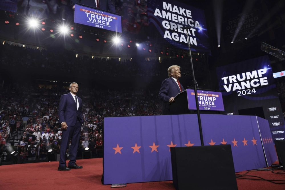 Former President Donald Trump, the Republican presidential nominee, speaks on stage in front of Robert F. Kennedy Jr. at the Desert Diamond Arena, in Glendale, Arizona, on Aug. 23. Former President Donald Trump, the Republican presidential nominee, speaks on stage in front of Robert F. Kennedy Jr. at the Desert Diamond Arena, in Glendale, Arizona, on Aug. 23.
